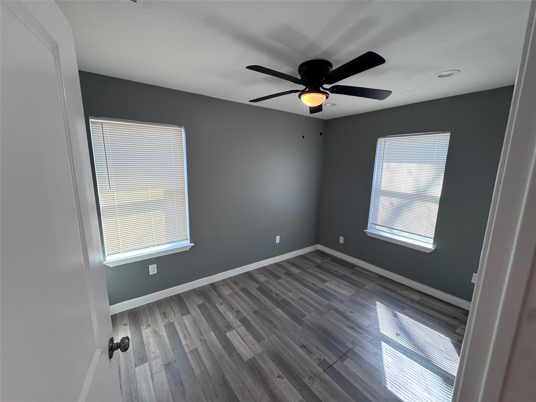4529 Dewberry Street Houston, TX 77021 - Photo 8 of 10 a view of an empty room and window and wooden floor