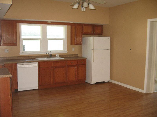 826 6th Street Rochelle, IL 61068 - Photo 2 of 10 a kitchen with a sink a window and stainless steel appliances