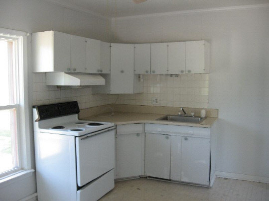 826 6th Street Rochelle, IL 61068 - Photo 6 of 10 a kitchen with cabinets appliances a sink and a window