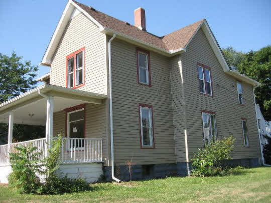 826 6th Street Rochelle, IL 61068 - Photo 9 of 10 a front view of a house with a yard
