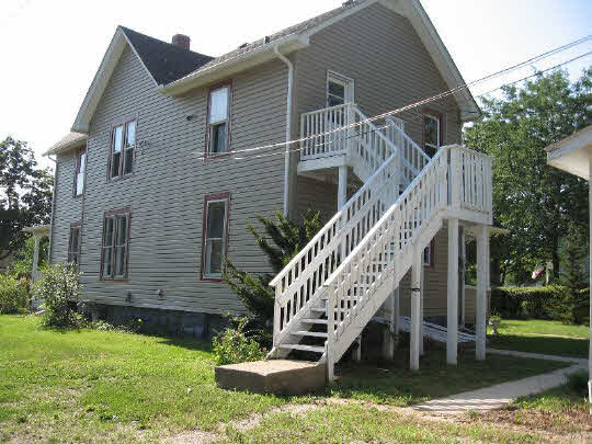 826 6th Street Rochelle, IL 61068 - Photo 10 of 10 a front view of a house with wooden stairs