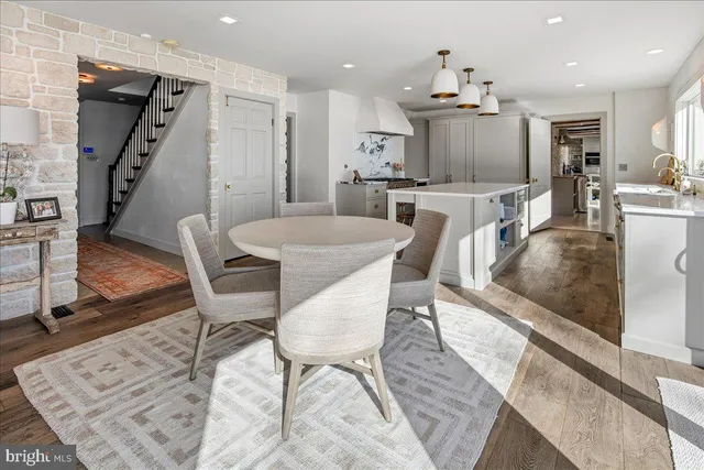 a spacious bathroom with a tub and a large window