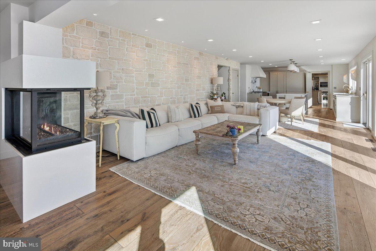 3903 Belle Rive Terrace Alexandria, VA 22309 - Photo 16 of 69 a living room with furniture and a fireplace