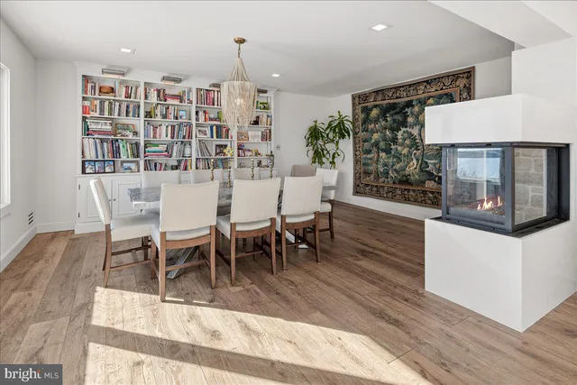 a bathroom with a bathtub sink and mirror