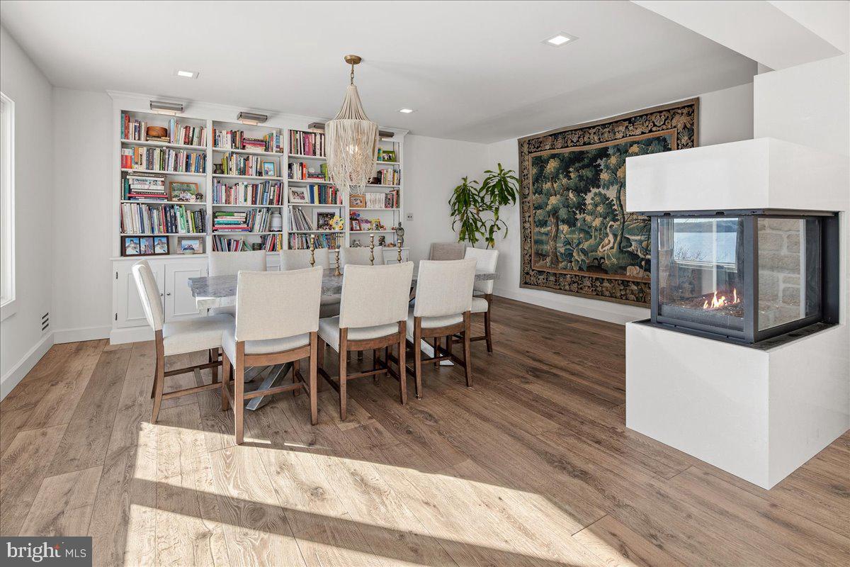 3903 Belle Rive Terrace Alexandria, VA 22309 - Photo 17 of 69 a view of a dining room with furniture window and wooden floor
