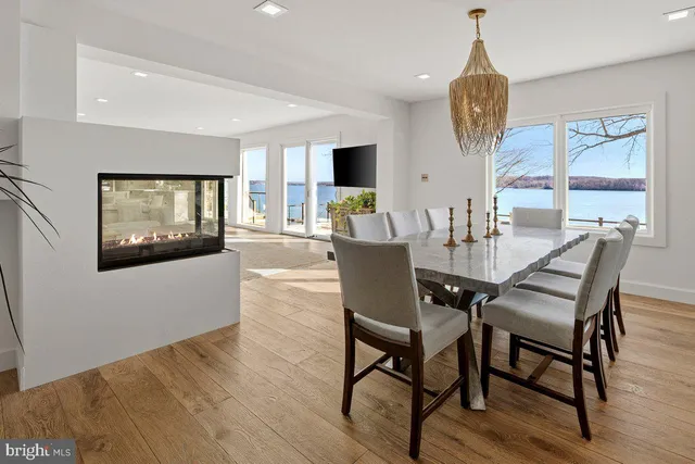 a view of kitchen with cabinets and window