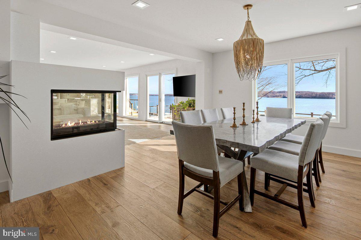 3903 Belle Rive Terrace Alexandria, VA 22309 - Photo 18 of 69 a view of a dining room with furniture window and wooden floor
