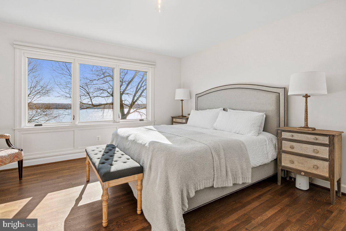 3903 Belle Rive Terrace Alexandria, VA 22309 - Photo 19 of 69 a bedroom with a bed and wooden floor
