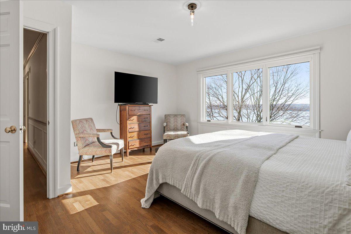 3903 Belle Rive Terrace Alexandria, VA 22309 - Photo 20 of 69 a bedroom with a bed and a flat screen tv