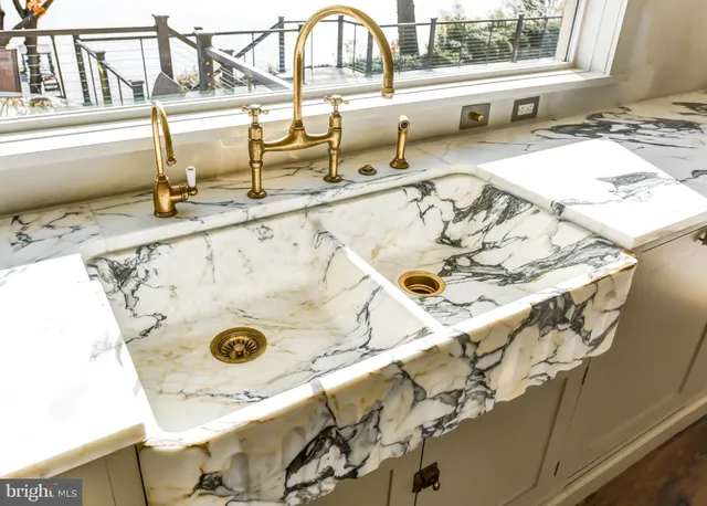 a bathroom with a toilet and a mirror