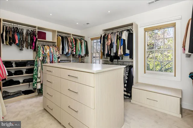 a en suite bathroom with a sink a mirror and a shower