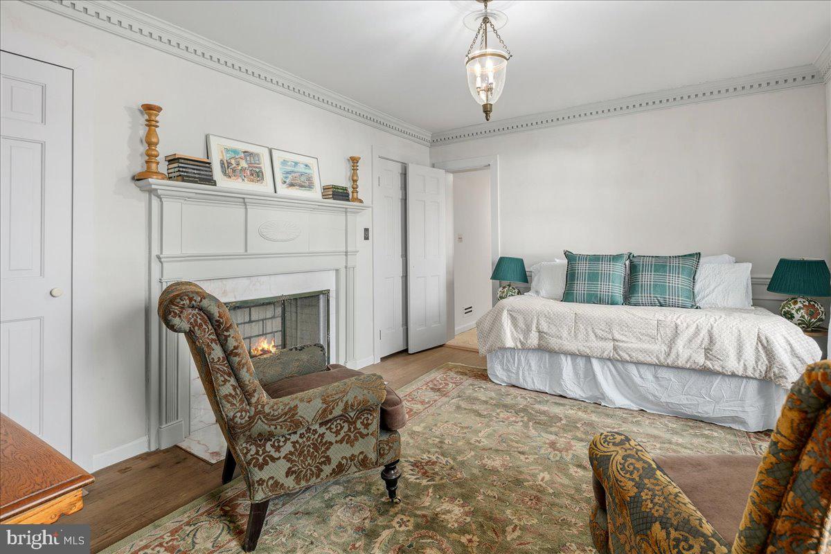 3903 Belle Rive Terrace Alexandria, VA 22309 - Photo 28 of 69 a bedroom with furniture and a fireplace