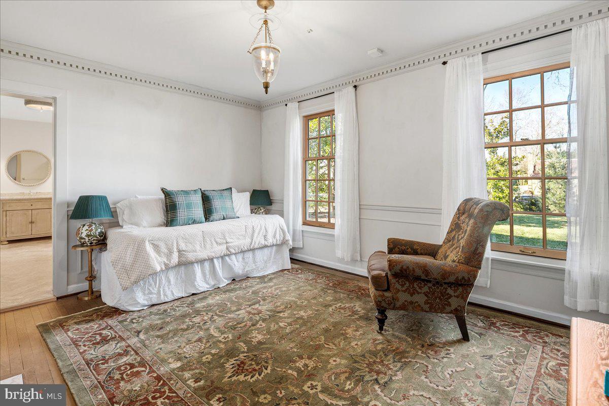 3903 Belle Rive Terrace Alexandria, VA 22309 - Photo 29 of 69 a bedroom with a bed and a window