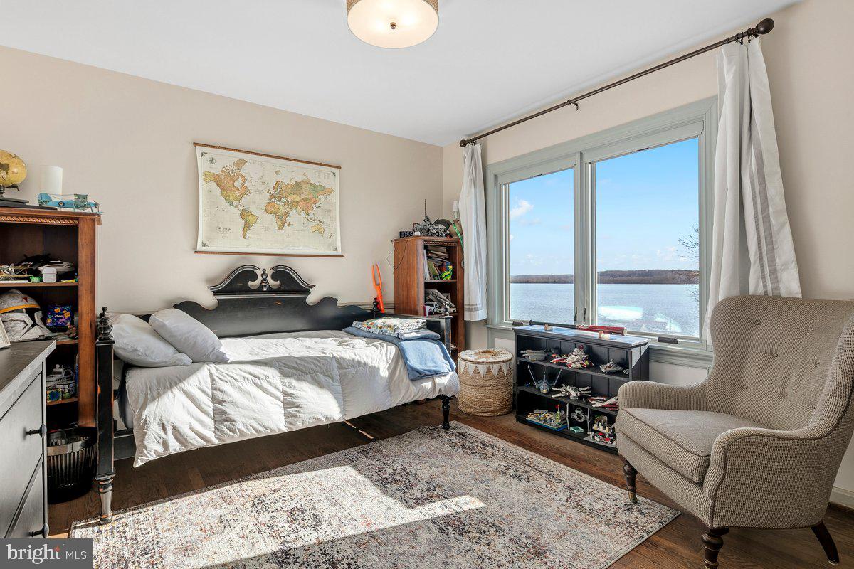 3903 Belle Rive Terrace Alexandria, VA 22309 - Photo 32 of 69 a living room with furniture wooden floor and a large window