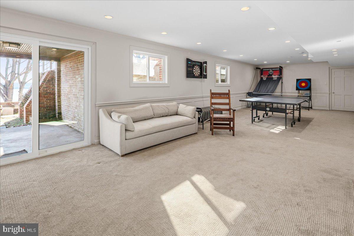 3903 Belle Rive Terrace Alexandria, VA 22309 - Photo 38 of 69 a living room with furniture and a flat screen tv