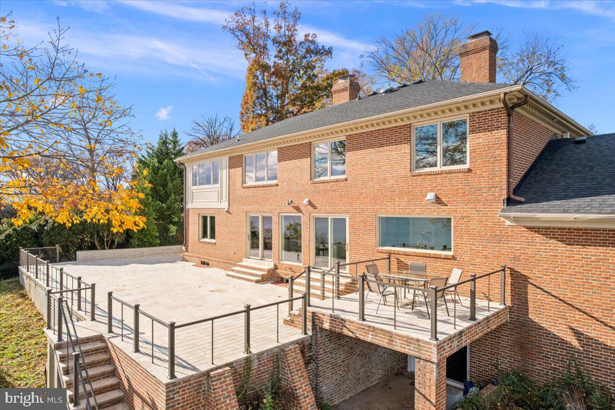 3903 Belle Rive Terrace Alexandria, VA 22309 - Photo 6 of 69 a view of a white house with large windows