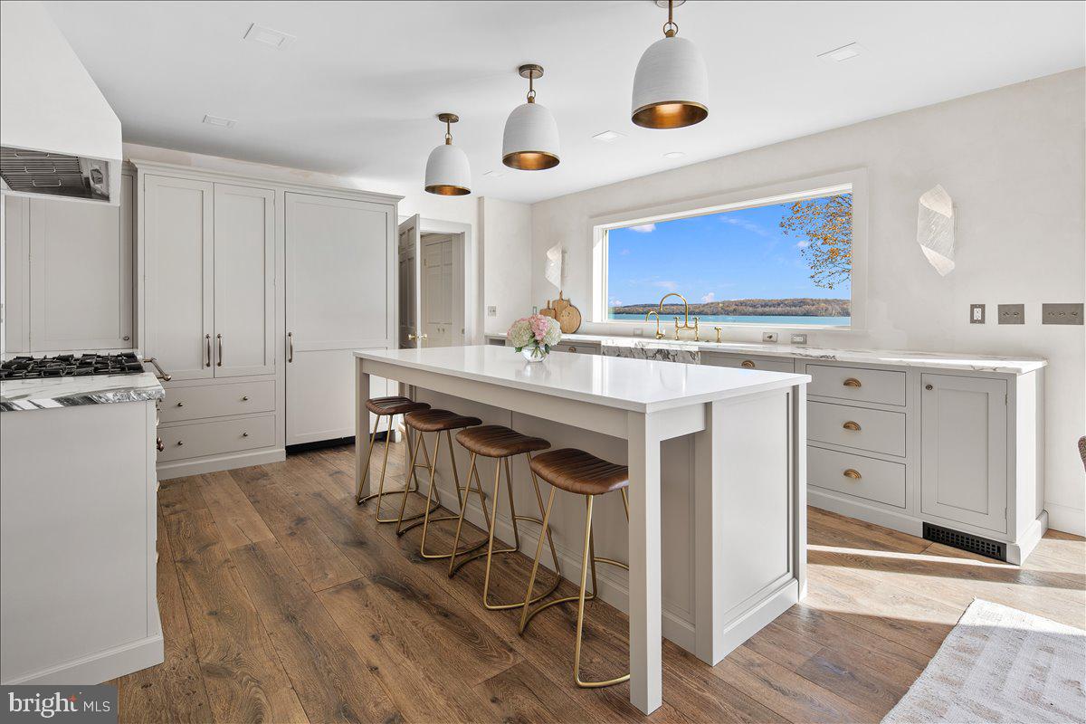 3903 Belle Rive Terrace Alexandria, VA 22309 - Photo 8 of 34 a kitchen with sink cabinets and stove top oven