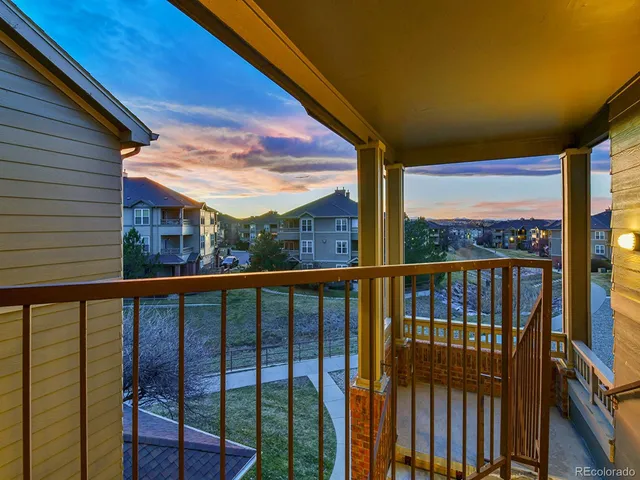a bathroom with a shower curtain and toilet
