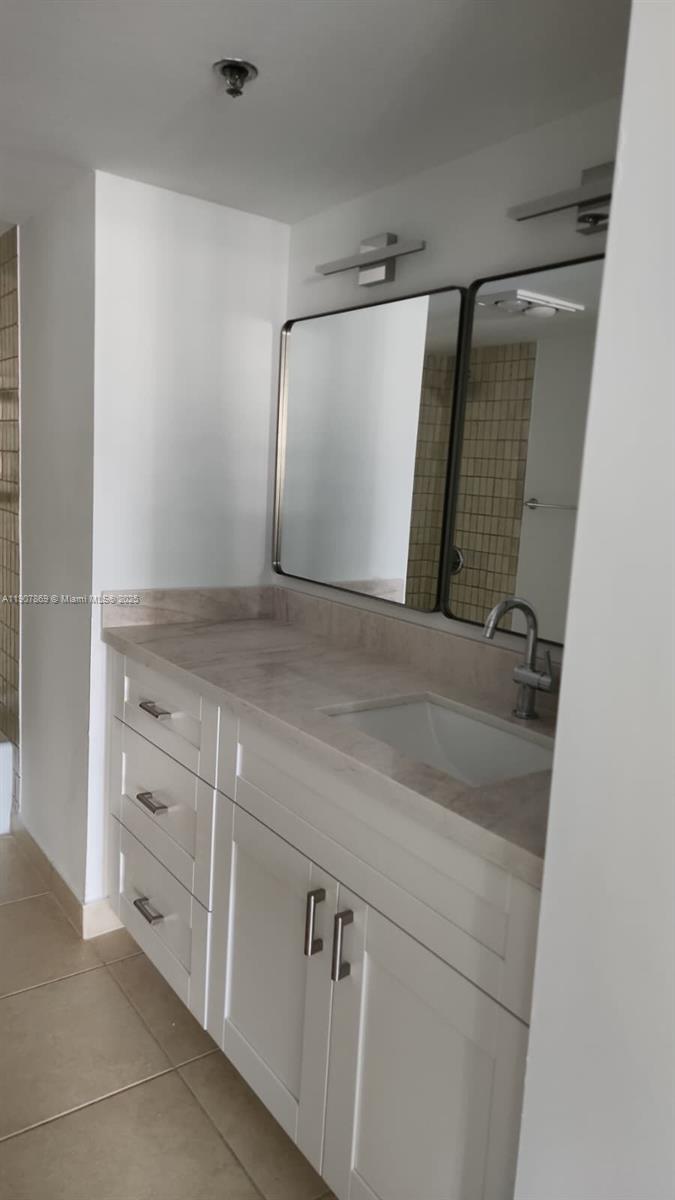 201 Crandon Boulevard, Unit 936 Key Biscayne, FL 33149 - Photo 11 of 18 a view of a sink and cabinets