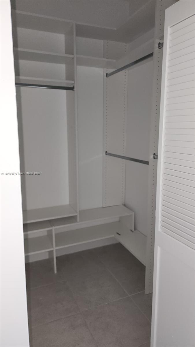 201 Crandon Boulevard, Unit 936 Key Biscayne, FL 33149 - Photo 14 of 18 a view of walk in closet with empty racks