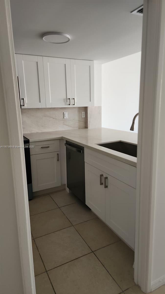 201 Crandon Boulevard, Unit 936 Key Biscayne, FL 33149 - Photo 4 of 18 a kitchen with a sink and cabinets