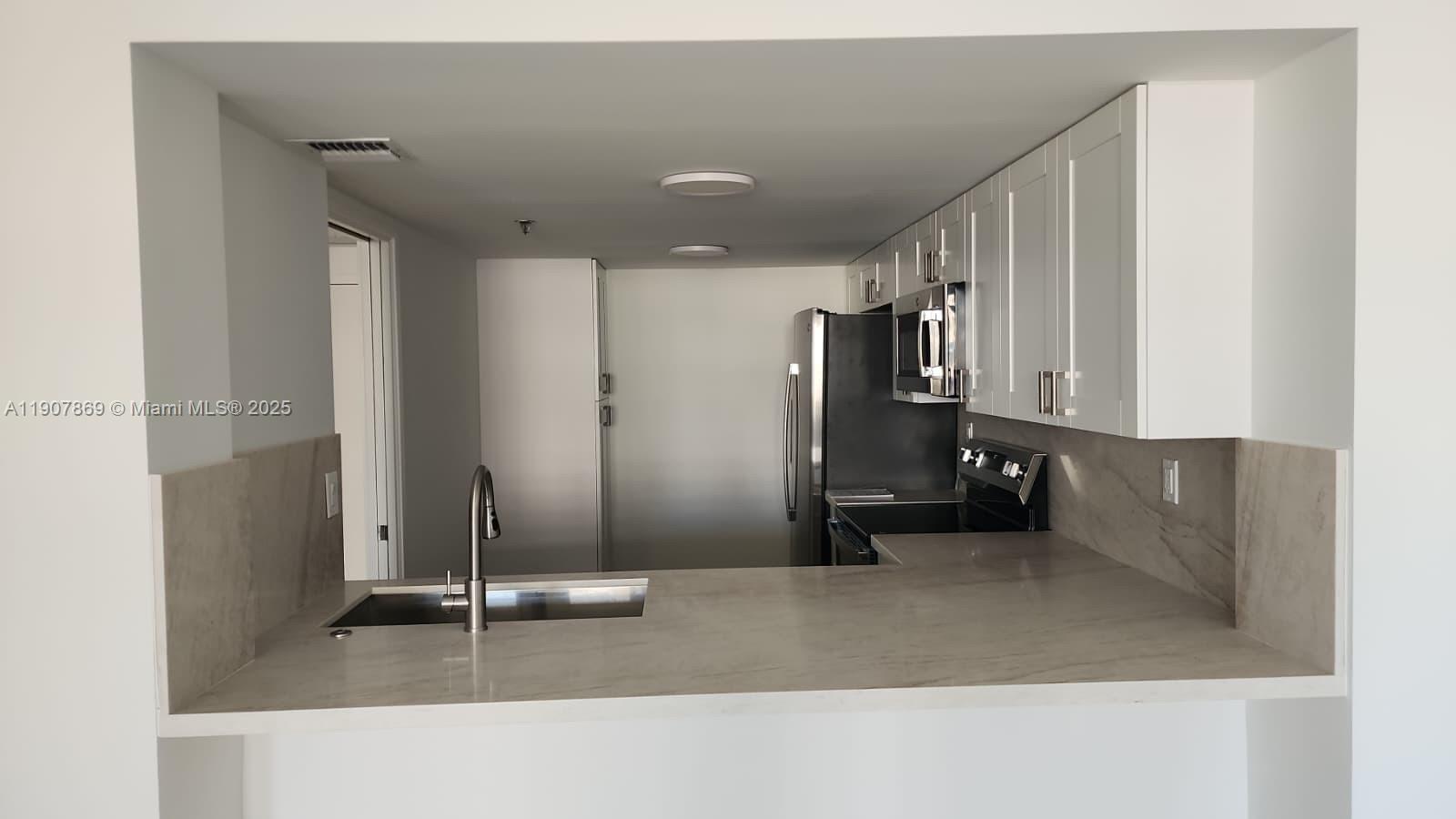 201 Crandon Boulevard, Unit 936 Key Biscayne, FL 33149 - Photo 6 of 18 a view of a storage & utility room