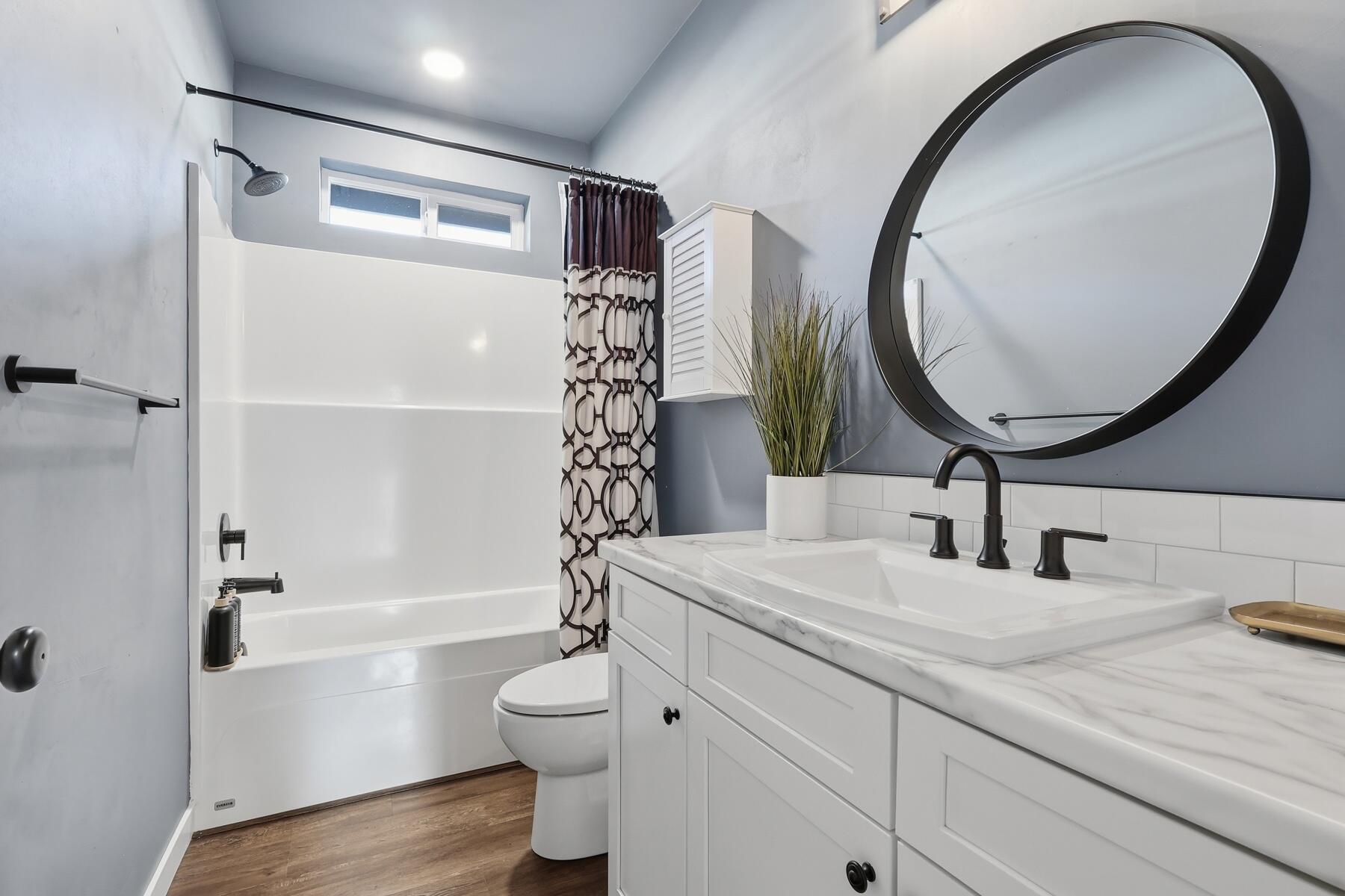 16455 Bassett Road La Pine, OR 97739 - Photo 19 of 44 a bathroom with a sink a toilet and a mirror