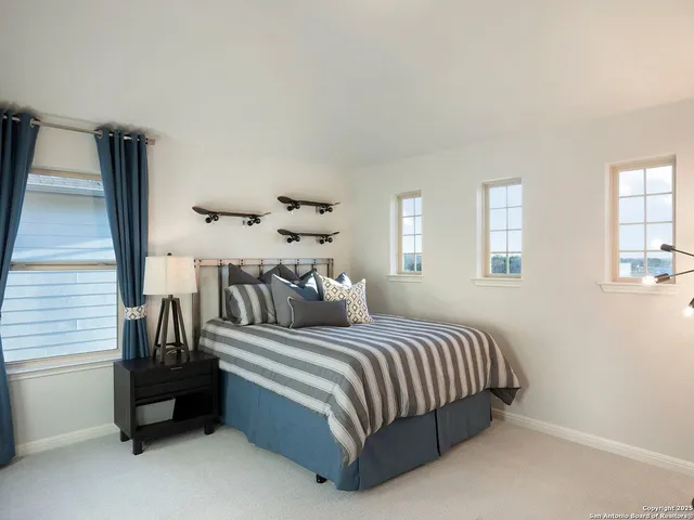 a bedroom with a bed and window