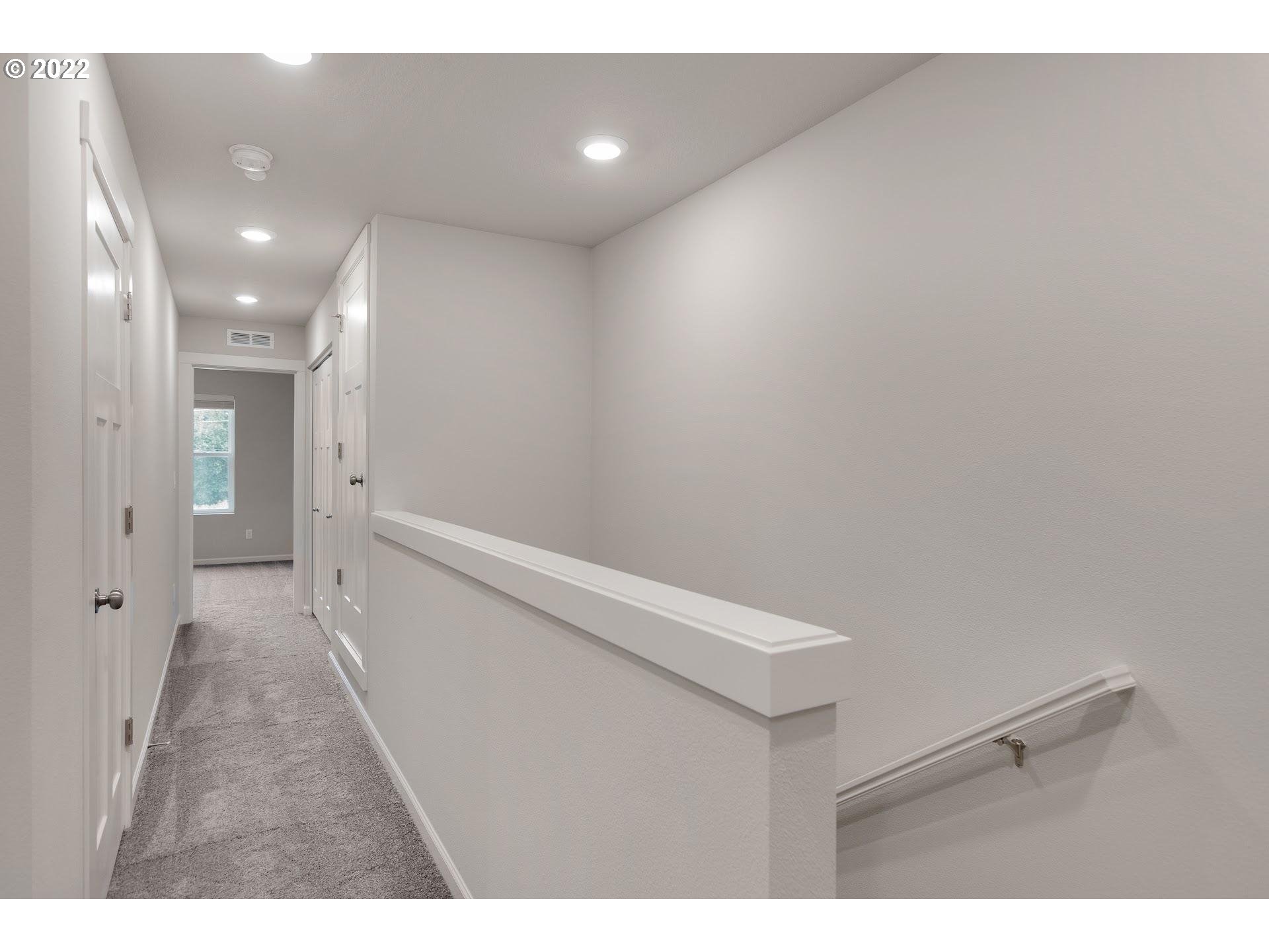 2415 South Trail View Ridgefield, WA 98642 - Photo 23 of 31 a view of hallway with stairs