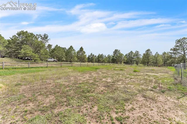 a view of a lake with houses in the back