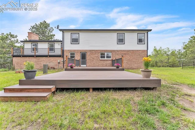 a balcony with table and chairs