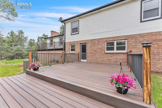 a flower garden is sitting in front of a house
