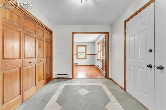 wooden floor with a bathroom