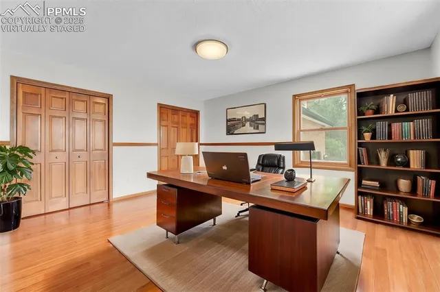 a workspace with furniture and bookshelf