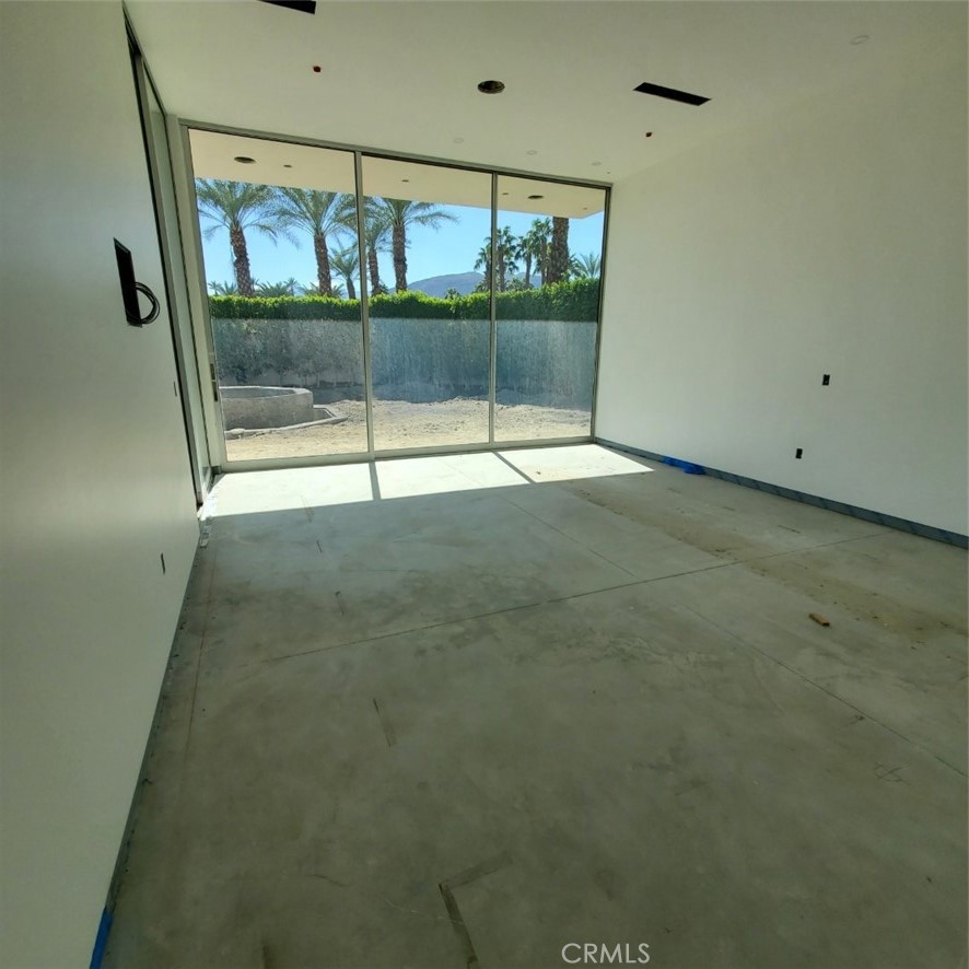 1 Makena Lane Rancho Mirage, CA 92270 - Photo 14 of 19 a view of an empty room with glass door