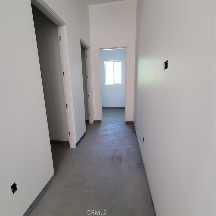 1 Makena Lane Rancho Mirage, CA 92270 - Photo 17 of 19 a view of a hallway with white walls