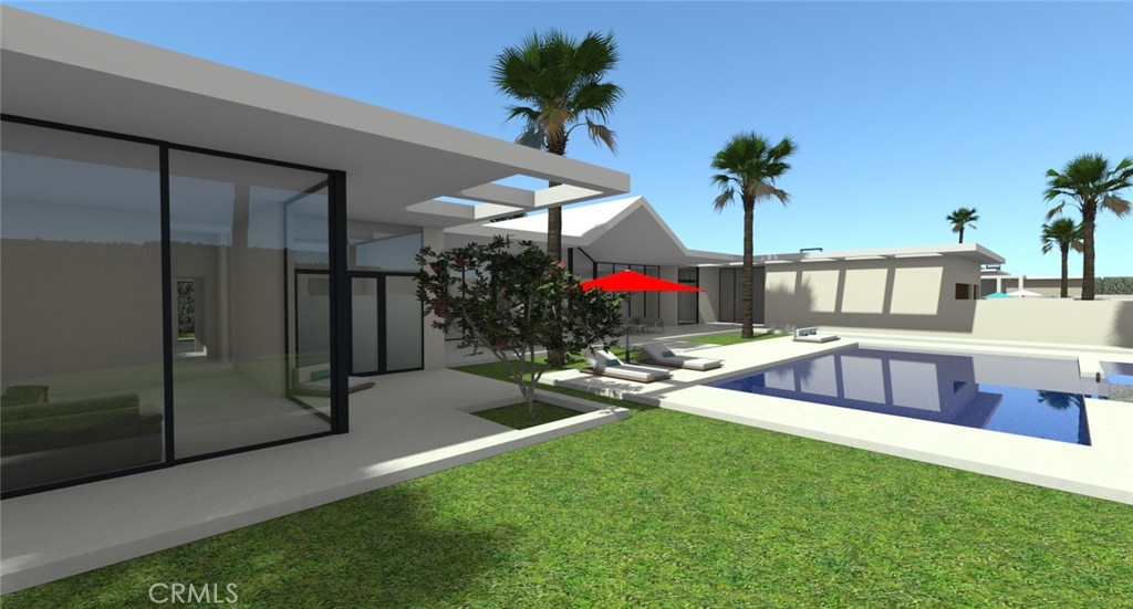 1 Makena Lane Rancho Mirage, CA 92270 - Photo 8 of 19 a view of a backyard with a patio and flower garden