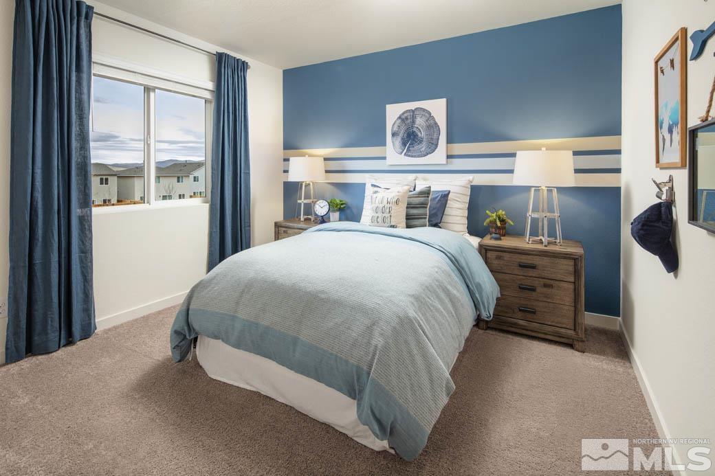 7789 Wandering Way, Unit LOT #243 Reno, NV 89506 - Photo 11 of 15 a bedroom with a bed and window