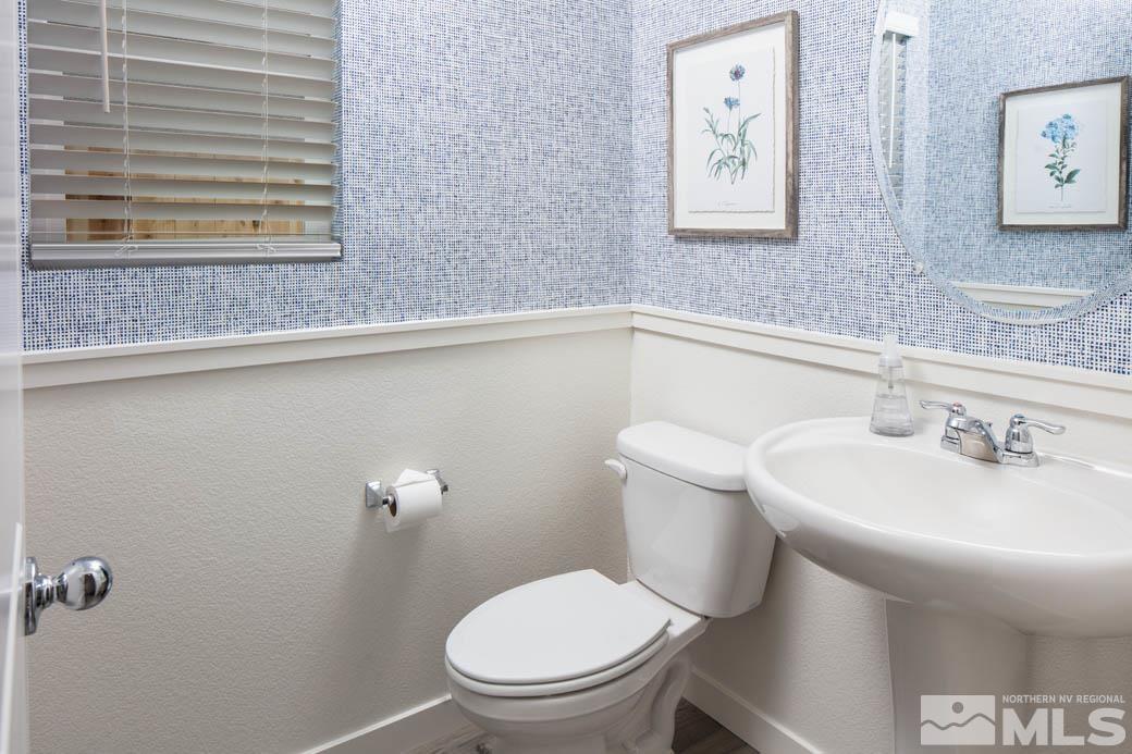 7789 Wandering Way, Unit LOT #243 Reno, NV 89506 - Photo 14 of 15 a bathroom with a sink mirror and toilet
