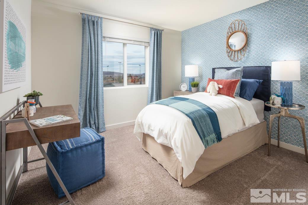 7789 Wandering Way, Unit LOT #243 Reno, NV 89506 - Photo 8 of 15 a bed room with a bed and a window