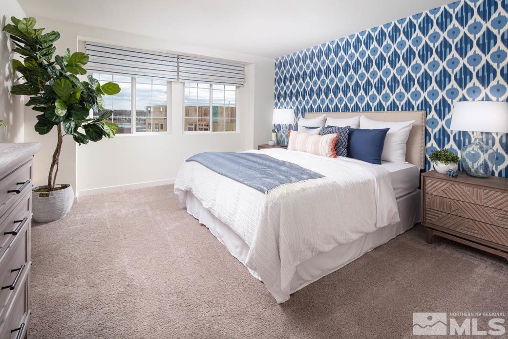 7789 Wandering Way, Unit LOT #243 Reno, NV 89506 - Photo 9 of 15 a bedroom with bed and a potted plant