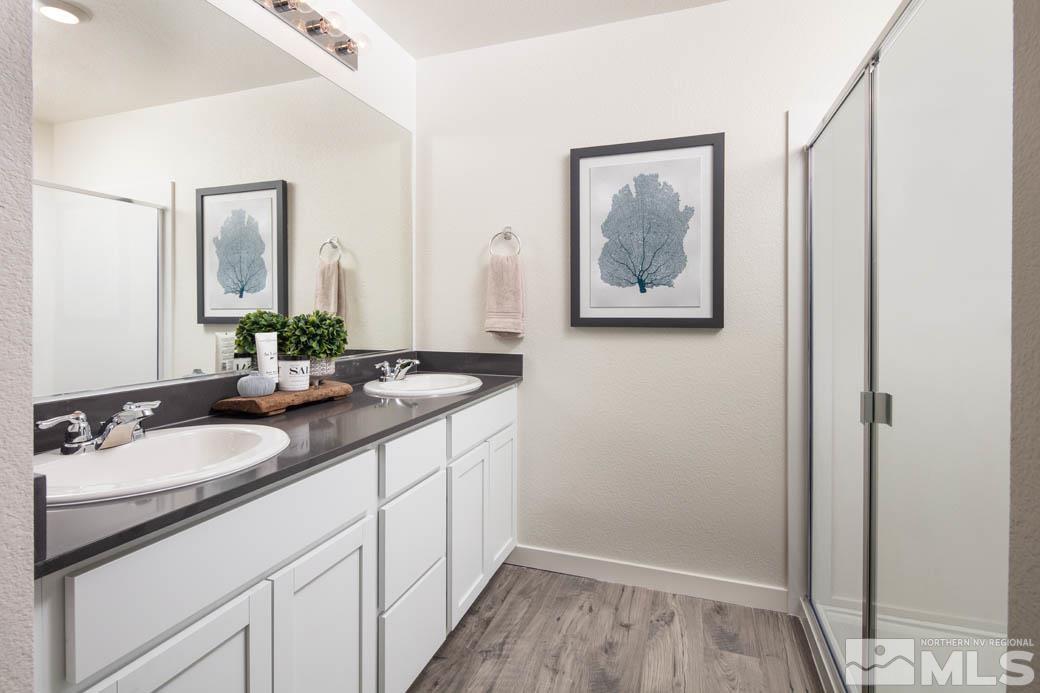 7789 Wandering Way, Unit LOT #243 Reno, NV 89506 - Photo 10 of 15 a bathroom with a sink and a mirror