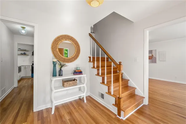 a view of entryway wooden floor and staircase