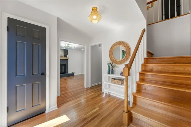 a view of living room with furniture and wooden floor