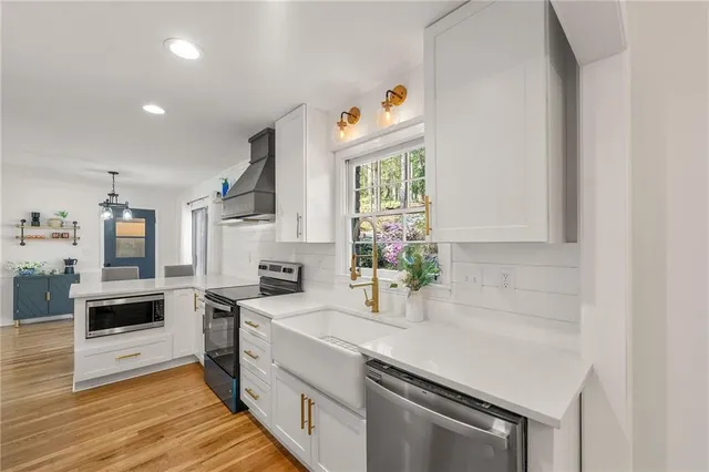 a kitchen that has a sink and a stove