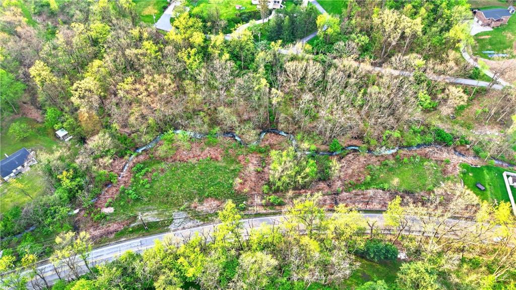 0 Clever Road McKees Rocks, PA 15136 - Photo 2 of 34 a backyard of a house with lots of green space and garden