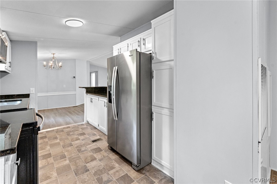 1172 Hendricks Road Pamplin, VA 23958 - Photo 13 of 36 a kitchen with a refrigerator and cabinets