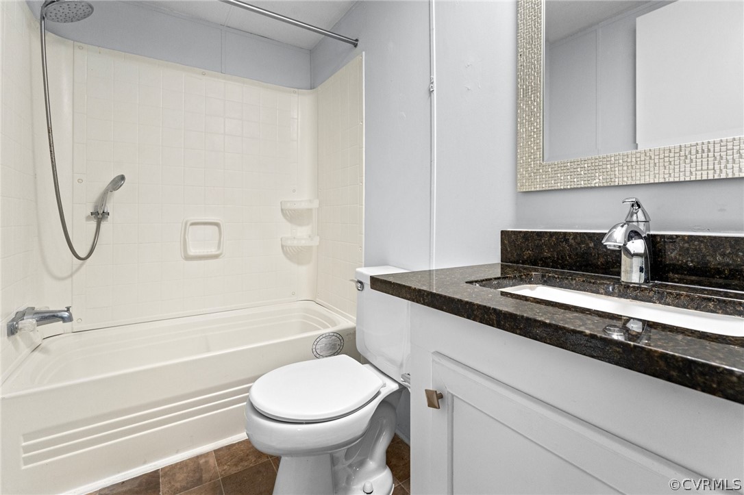 1172 Hendricks Road Pamplin, VA 23958 - Photo 24 of 36 a bathroom with a granite countertop toilet sink and mirror