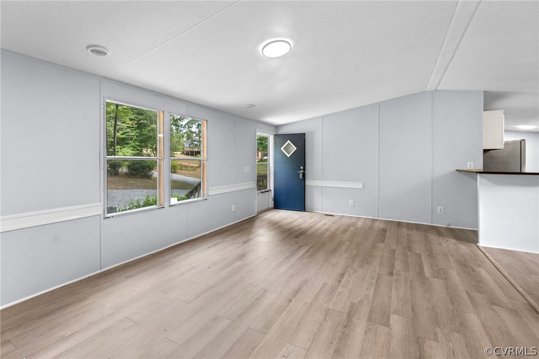 1172 Hendricks Road Pamplin, VA 23958 - Photo 7 of 36 an empty room with wooden floor and windows