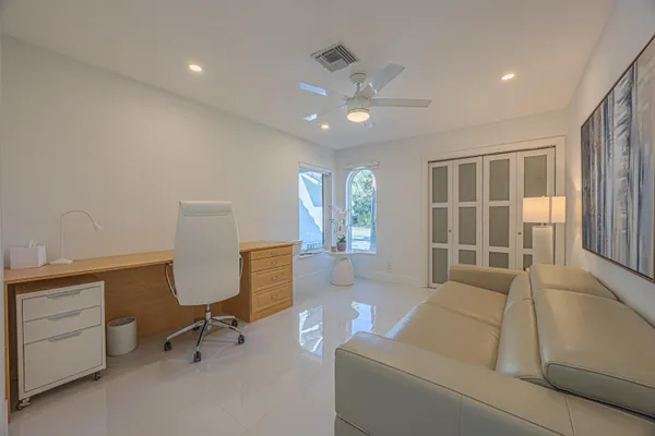 a living room with furniture and a window